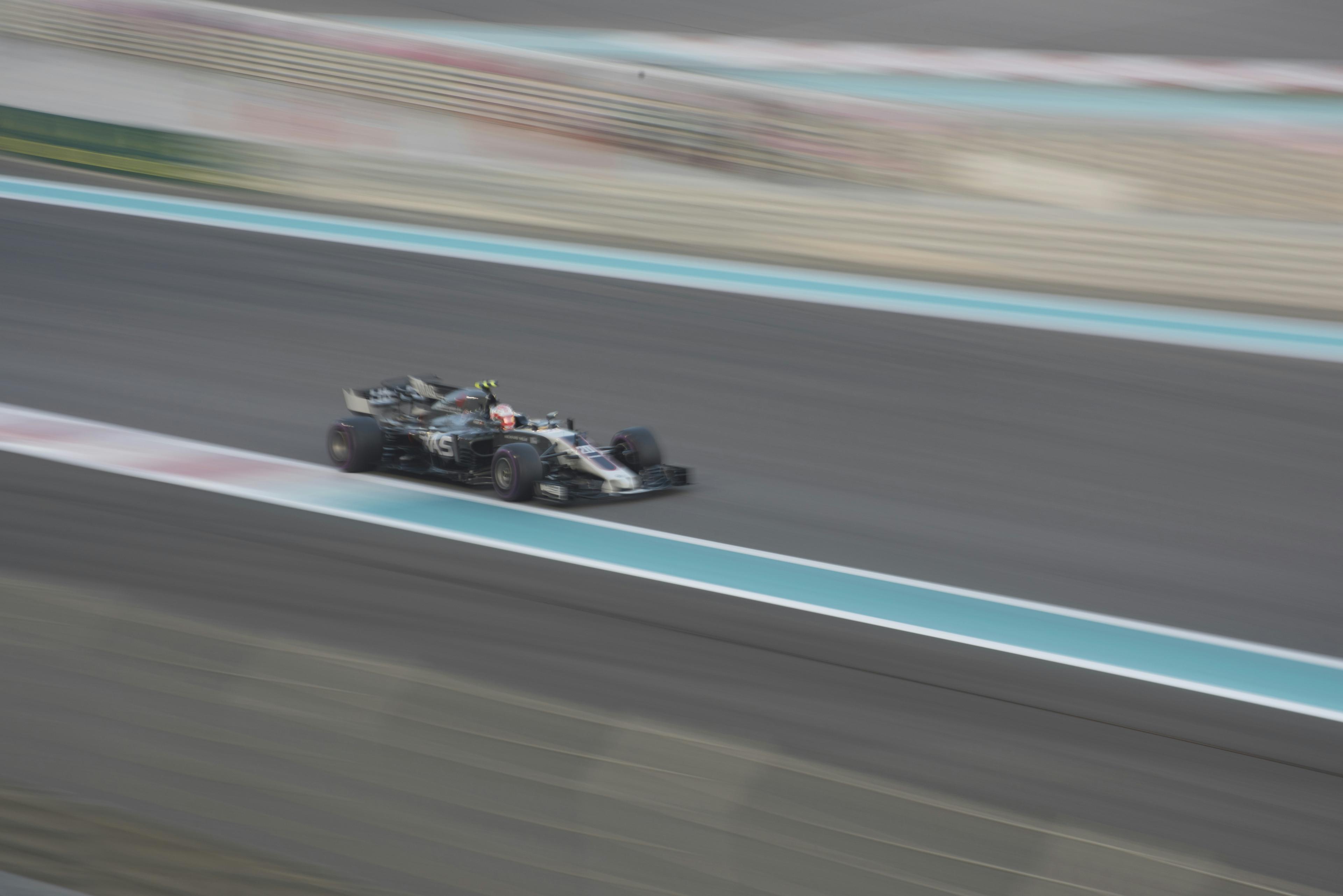 Formula race car on track at high speed with motion blur