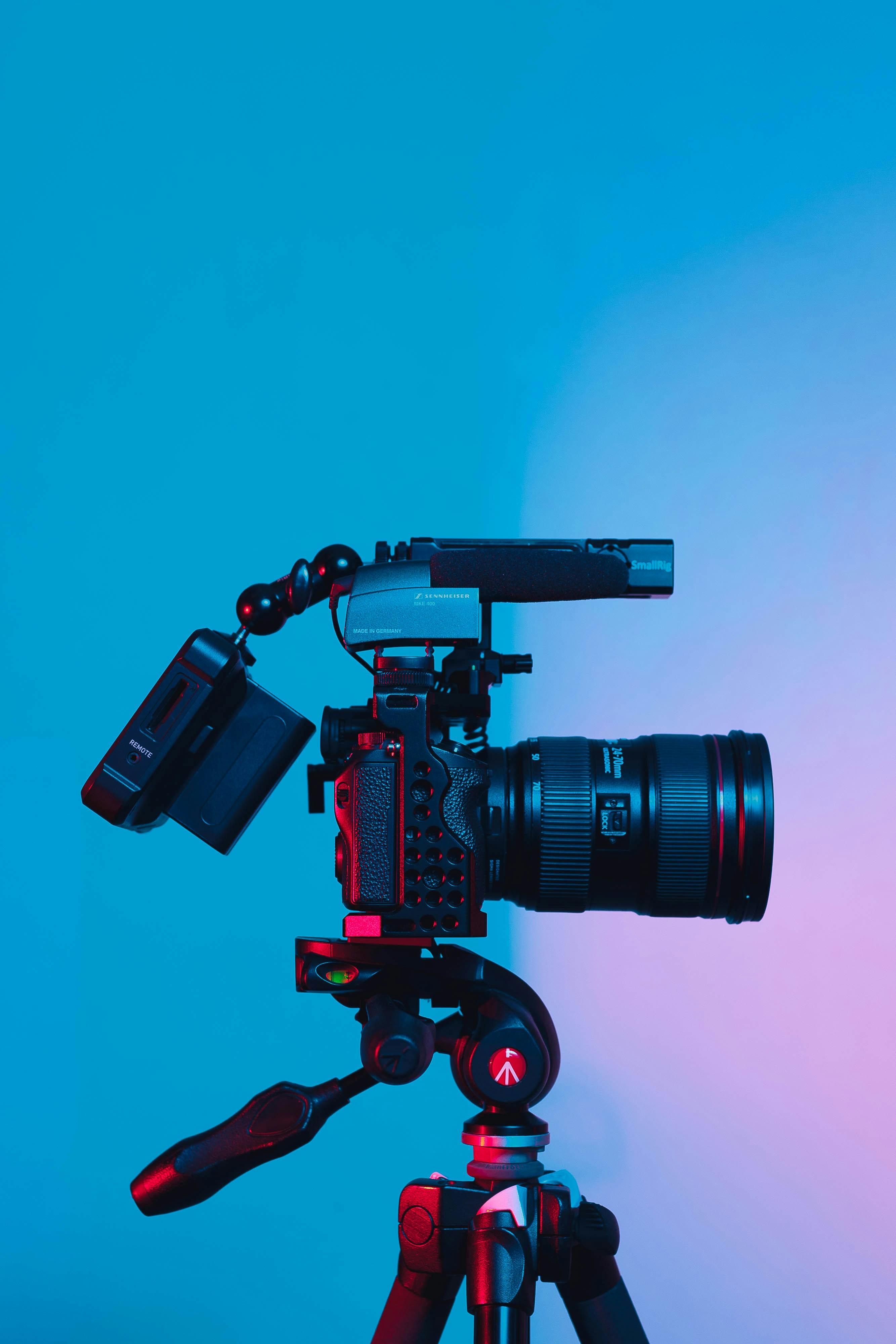Professional video production camera on set with dramatic lighting